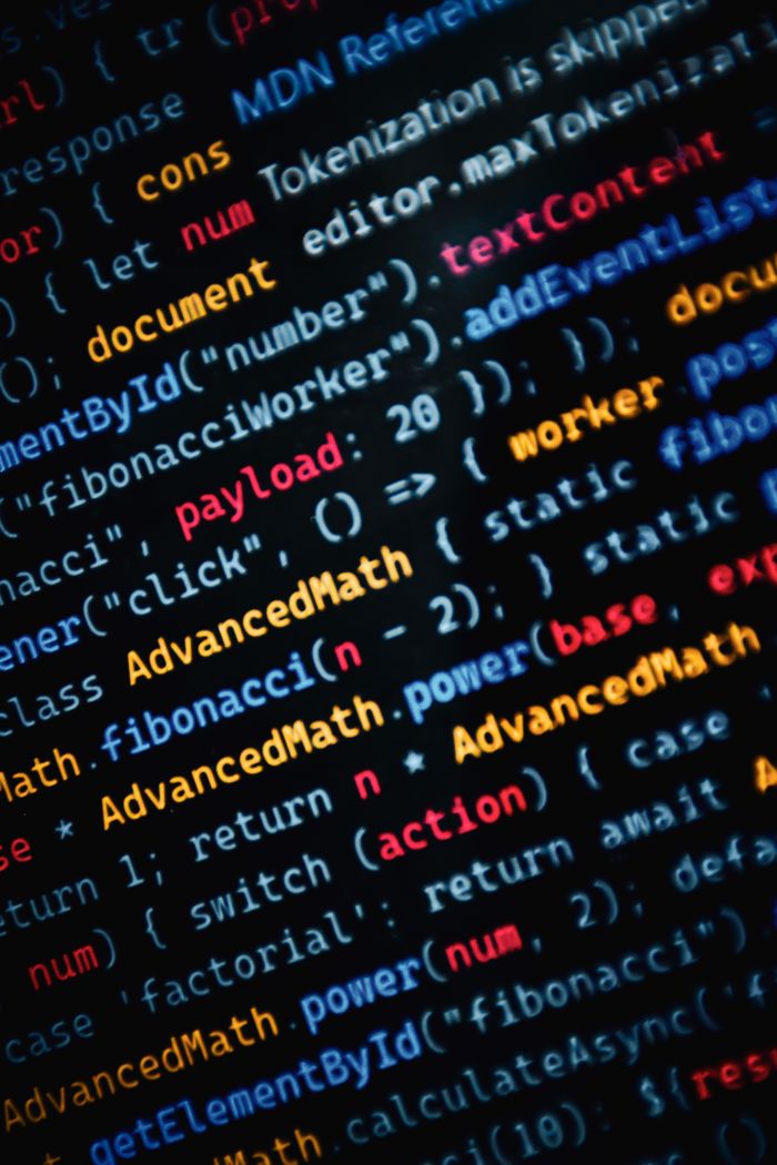 about-us Close-up of vibrant JavaScript code displayed on a monitor showcasing web development.